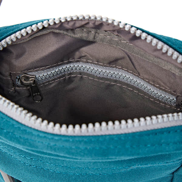 Roka Bond Deep Teal Recycled Canvas Crossbody Bag, first interior view.
