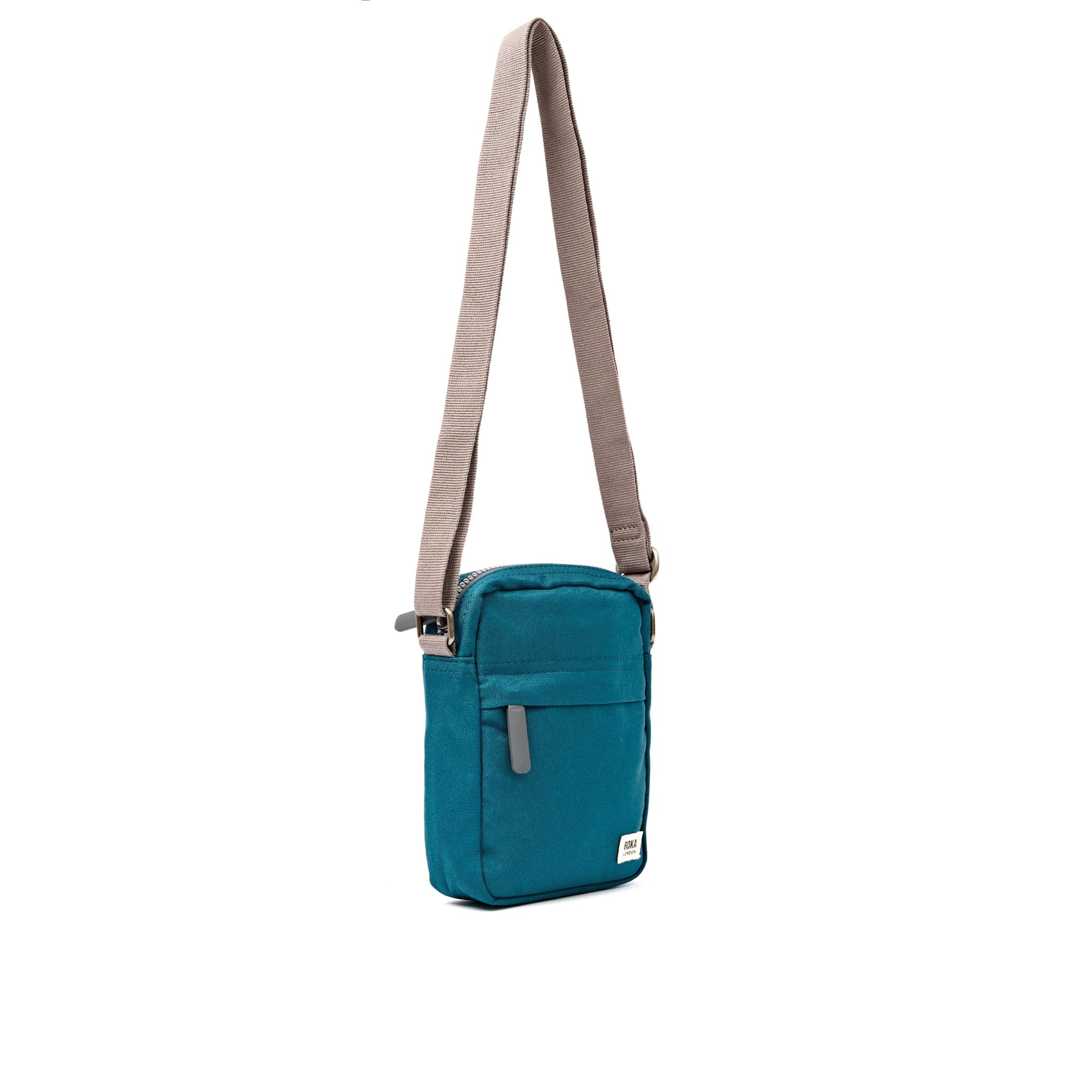 Roka Bond Deep Teal Recycled Canvas Crossbody Bag, side view.