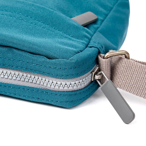 Roka Bond Deep Teal Recycled Canvas Crossbody Bag, zip detail.