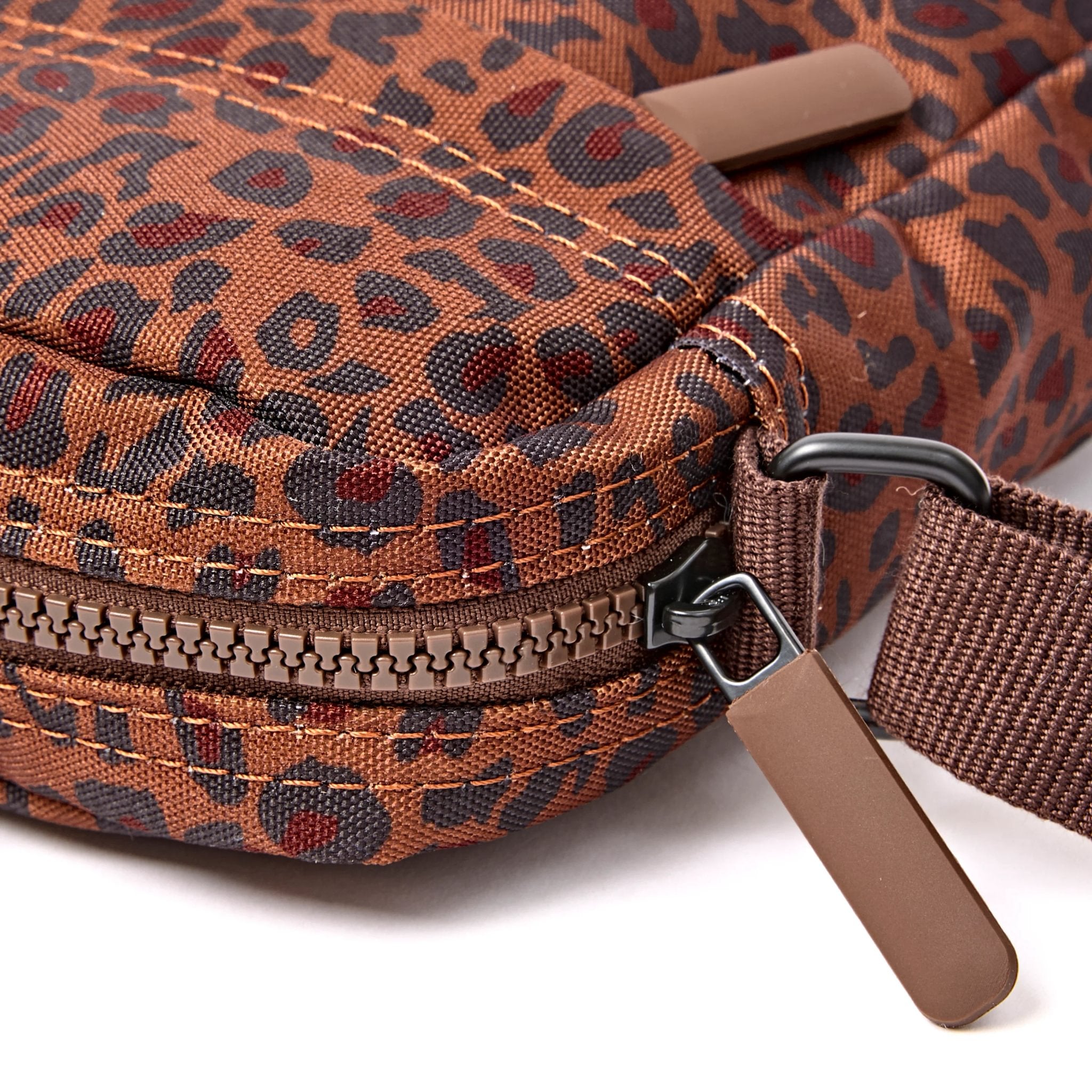 Roka Bond Mini Leopard Recycled Canvas Crossbody Bag, zip detail.