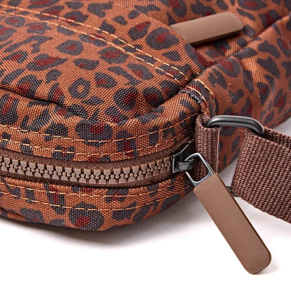 Roka Bond Mini Leopard Recycled Canvas Crossbody Bag, zip detail.