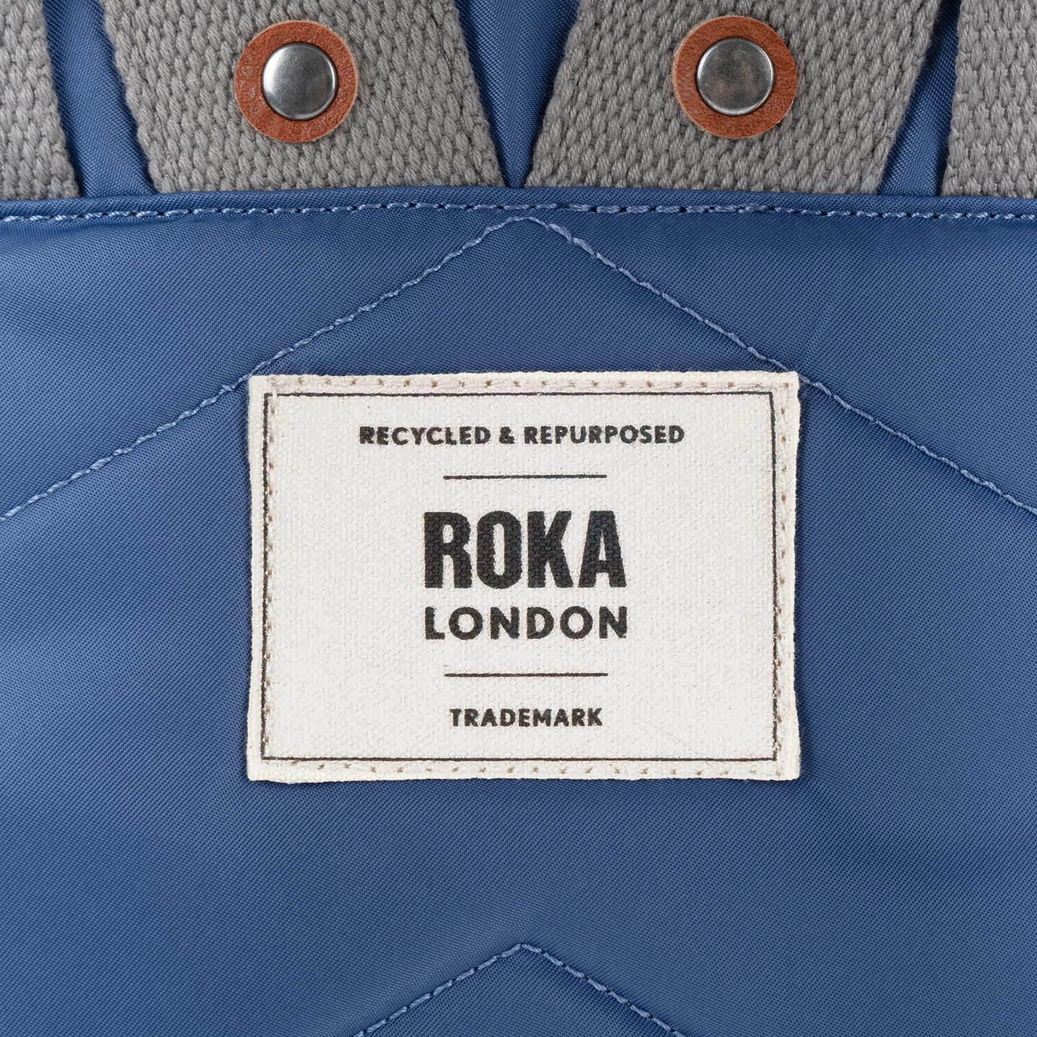 Roka Canfield B Recycled Nylon Burnt Blue, brand label detail.