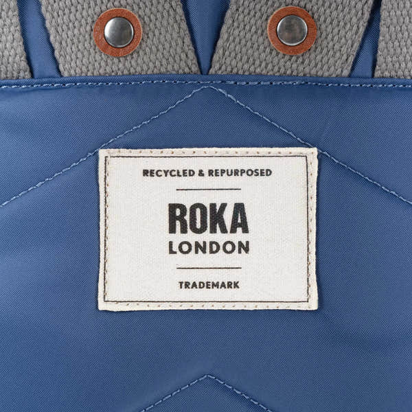Roka Canfield B Recycled Nylon Burnt Blue, brand label detail.