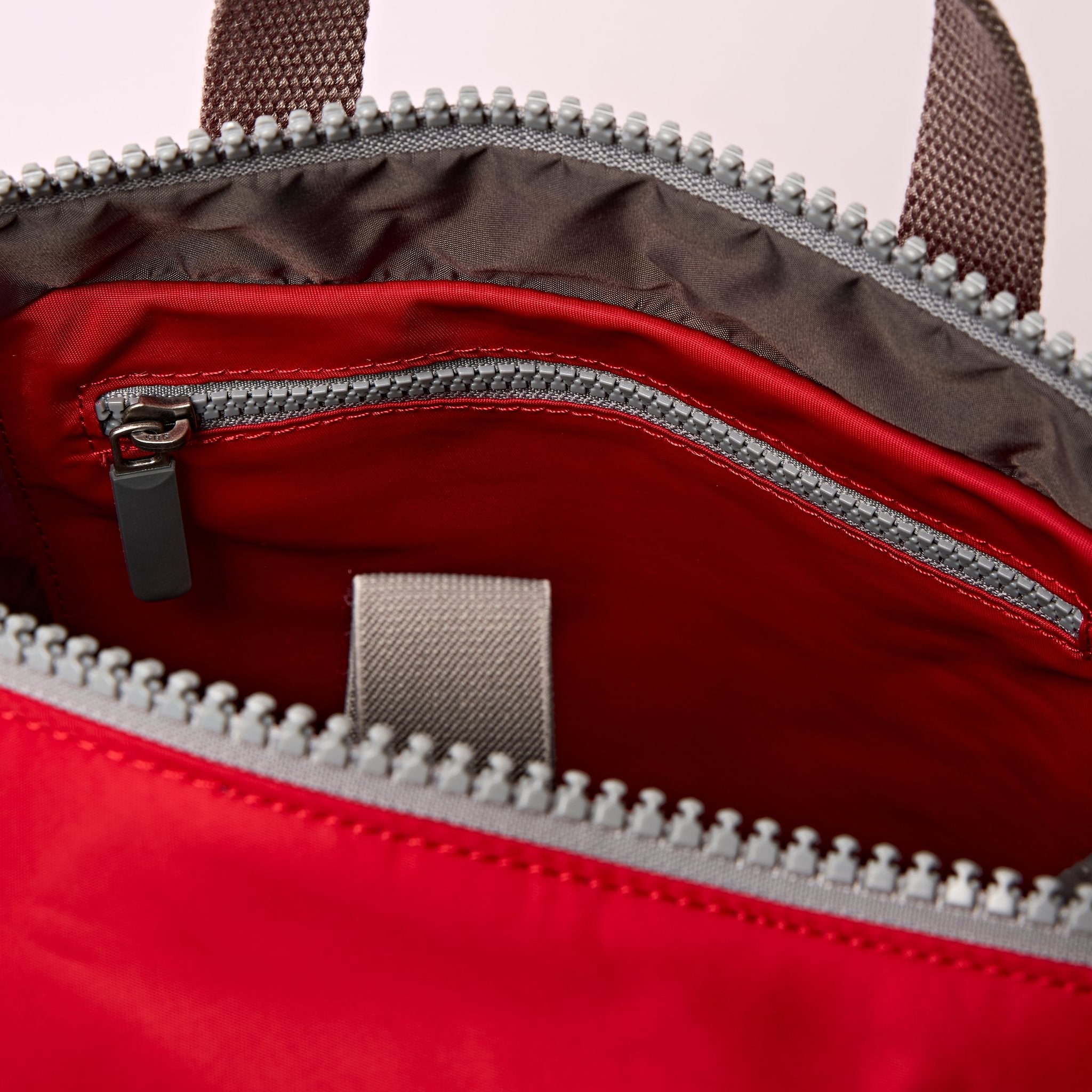 Roka Canfield B Sustainable Nylon Cranberry, side view.