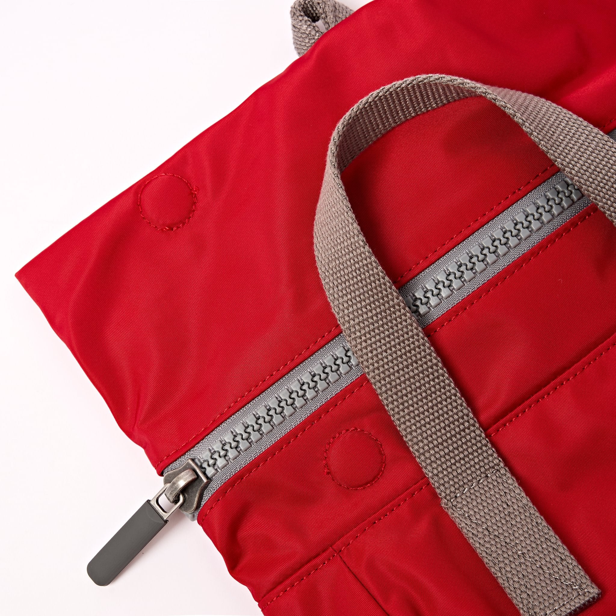 Roka Canfield B Sustainable Nylon Cranberry, zip detail.