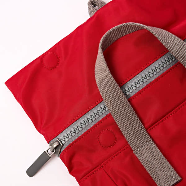 Roka Canfield B Sustainable Nylon Cranberry, zip detail.