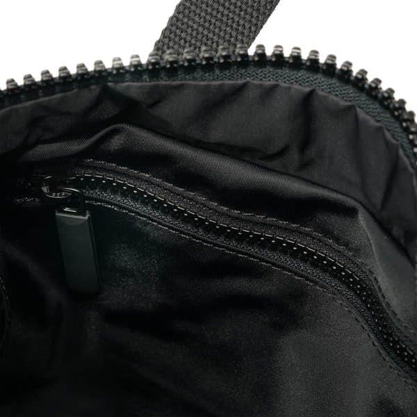 Roka Canfield Medium Avocado Recycled Nylon Backpack, side view.