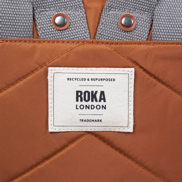 Roka Canfield Medium Bran Recycled Nylon Backpack, brand label detail.