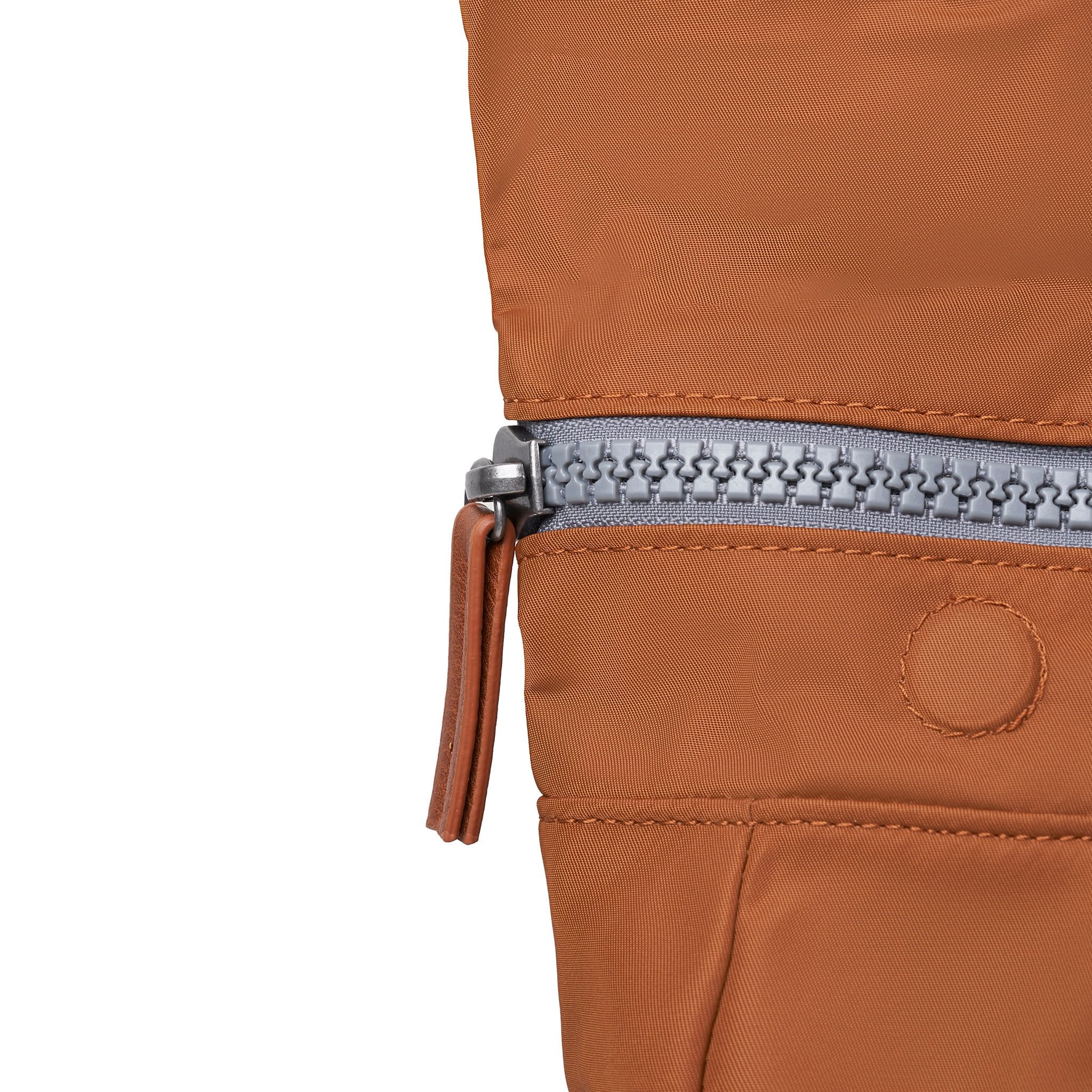 Roka Canfield Medium Bran Recycled Nylon Backpack, zip detail.