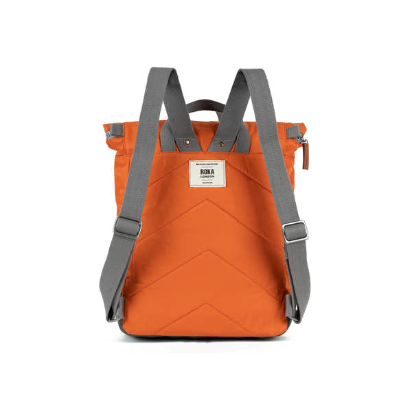 Roka Canfield Medium Burnt Orange Recycled Nylon Backpack, back view.