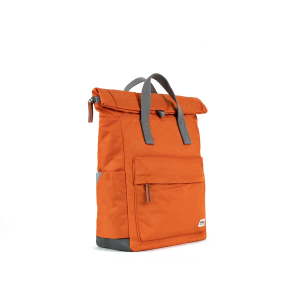 Roka Canfield Medium Burnt Orange Recycled Nylon Backpack, side view.