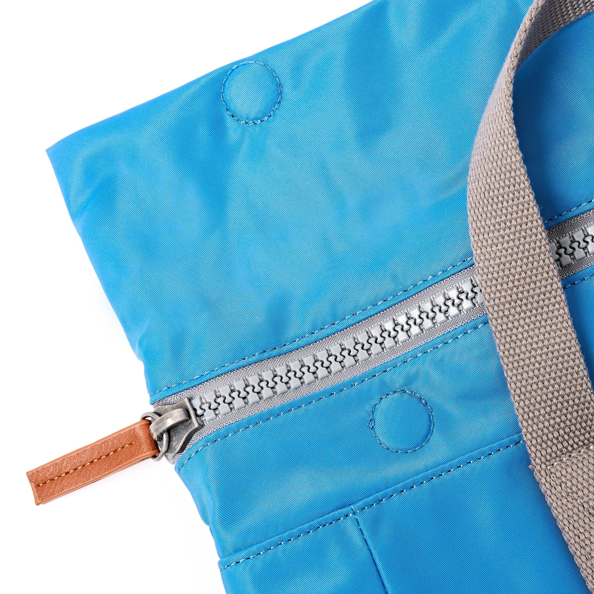 Roka Canfield Medium Malibu Blue Recycled Nylon Backpack, zip detail.