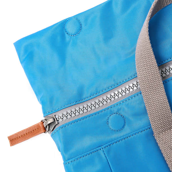 Roka Canfield Medium Malibu Blue Recycled Nylon Backpack, zip detail.