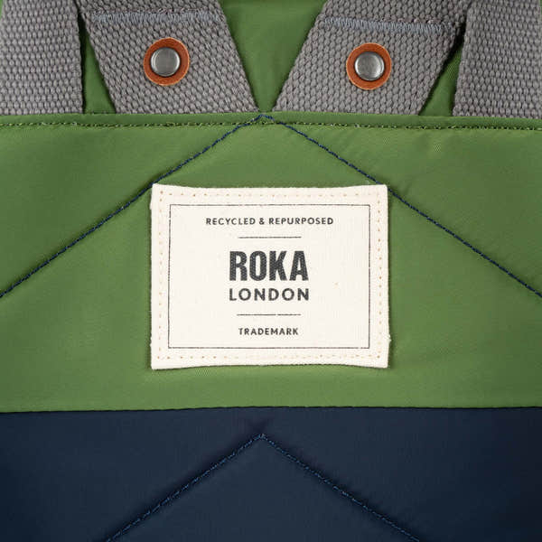 Roka Canfield Medium Midnight Recycled Nylon Backpack, brand label detail.