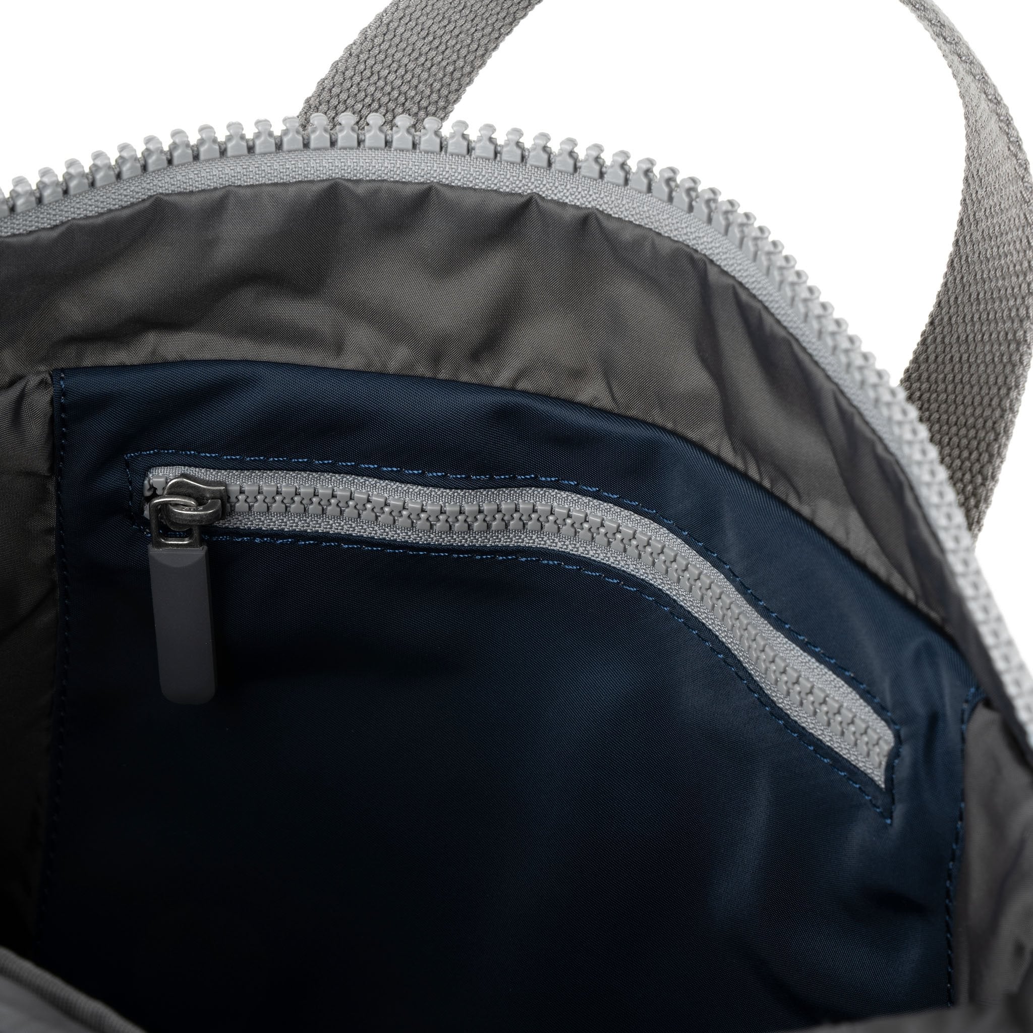 Roka Canfield Medium Midnight Recycled Nylon Backpack, side view.