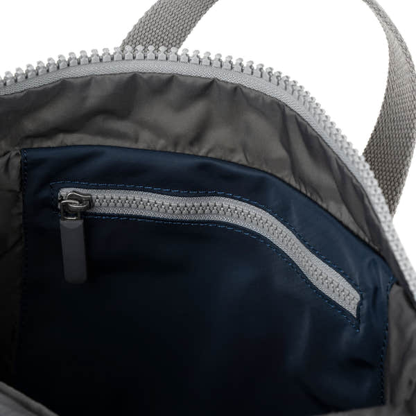 Roka Canfield Medium Midnight Recycled Nylon Backpack, side view.