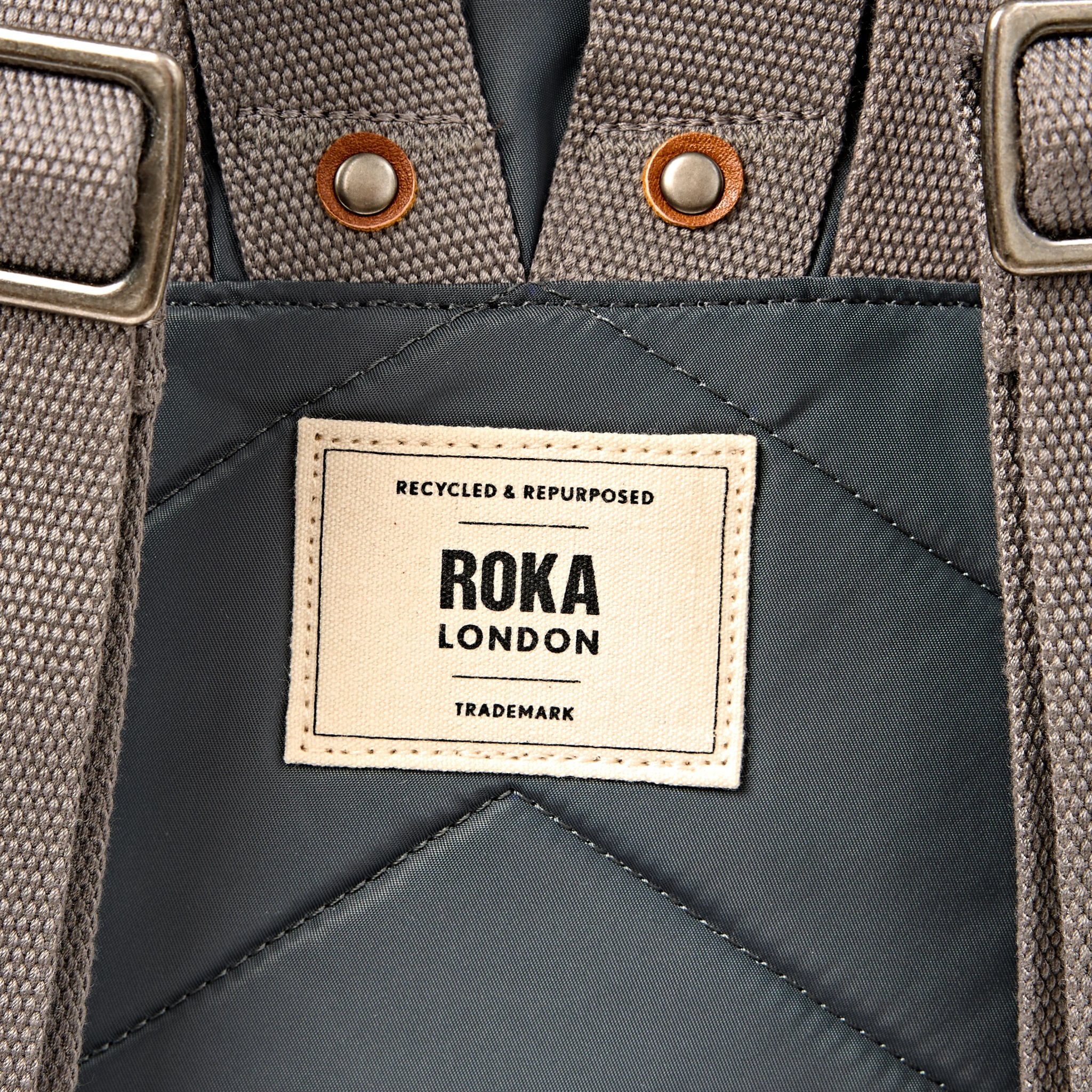 Roka Canfield Small Beluga Recycled Nylon Backpack, brand label detail.