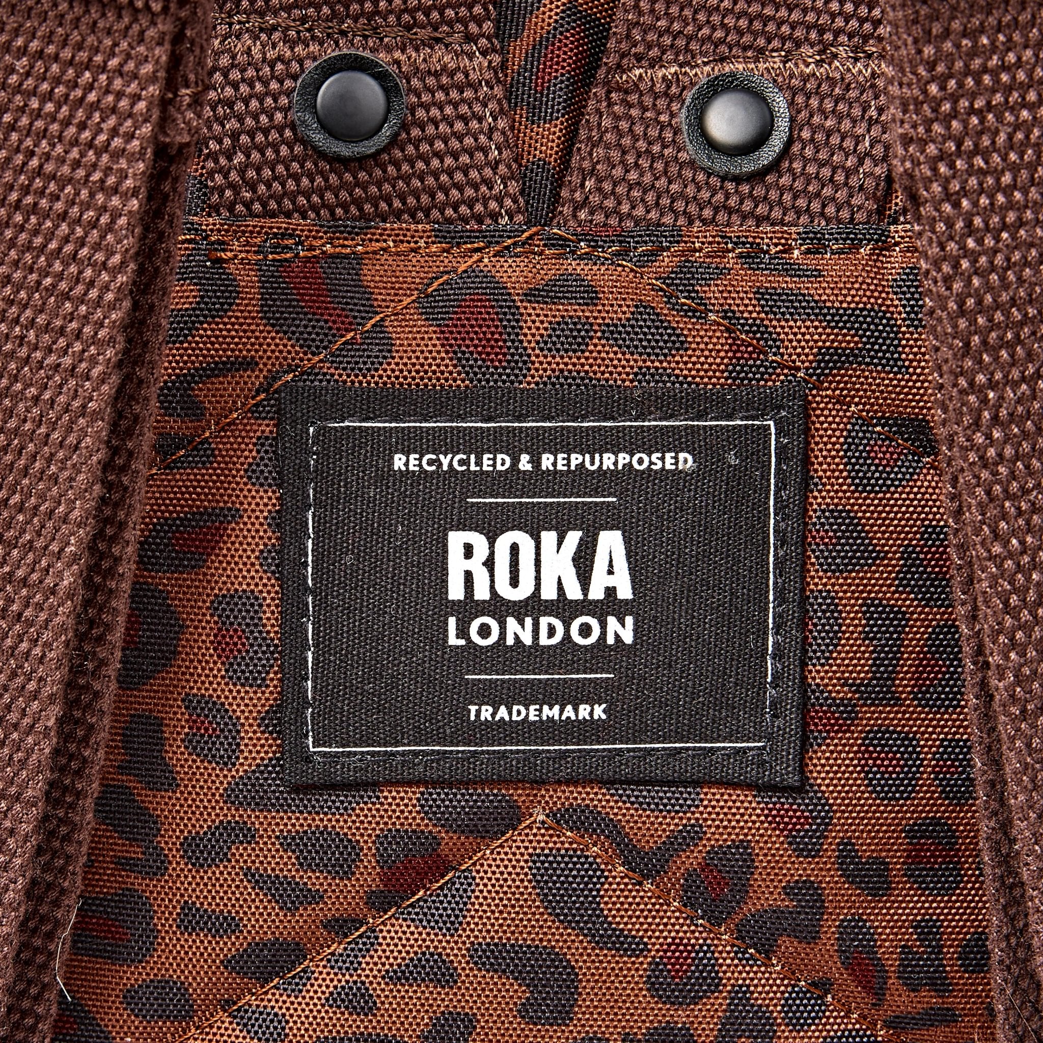 Roka Canfield Small Mini Leopard Recycled Canvas Backpack, brand label detail.
