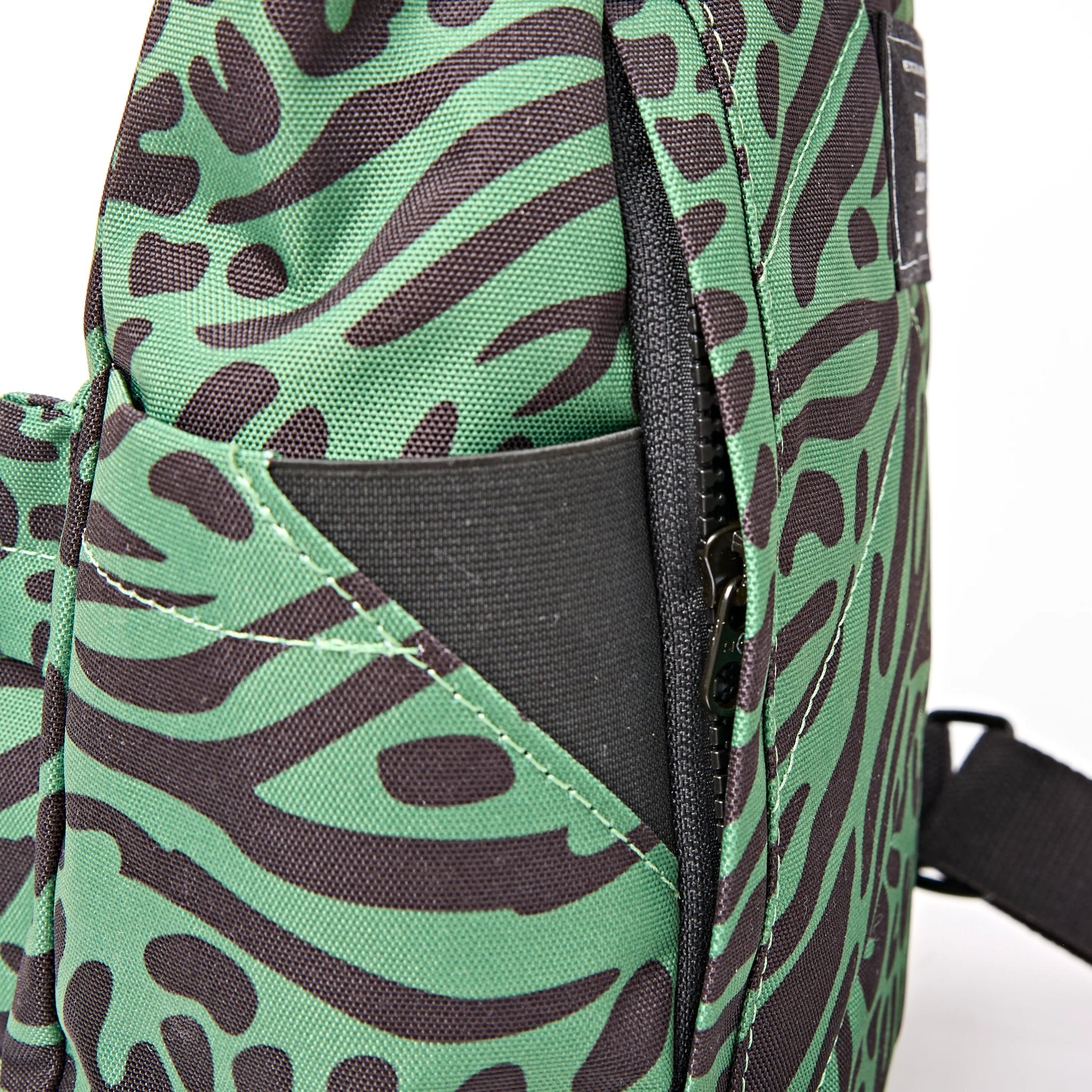 Roka Canfield Small Mixed Animal Artichoke Recycled Canvas Backpack, hardware detail.