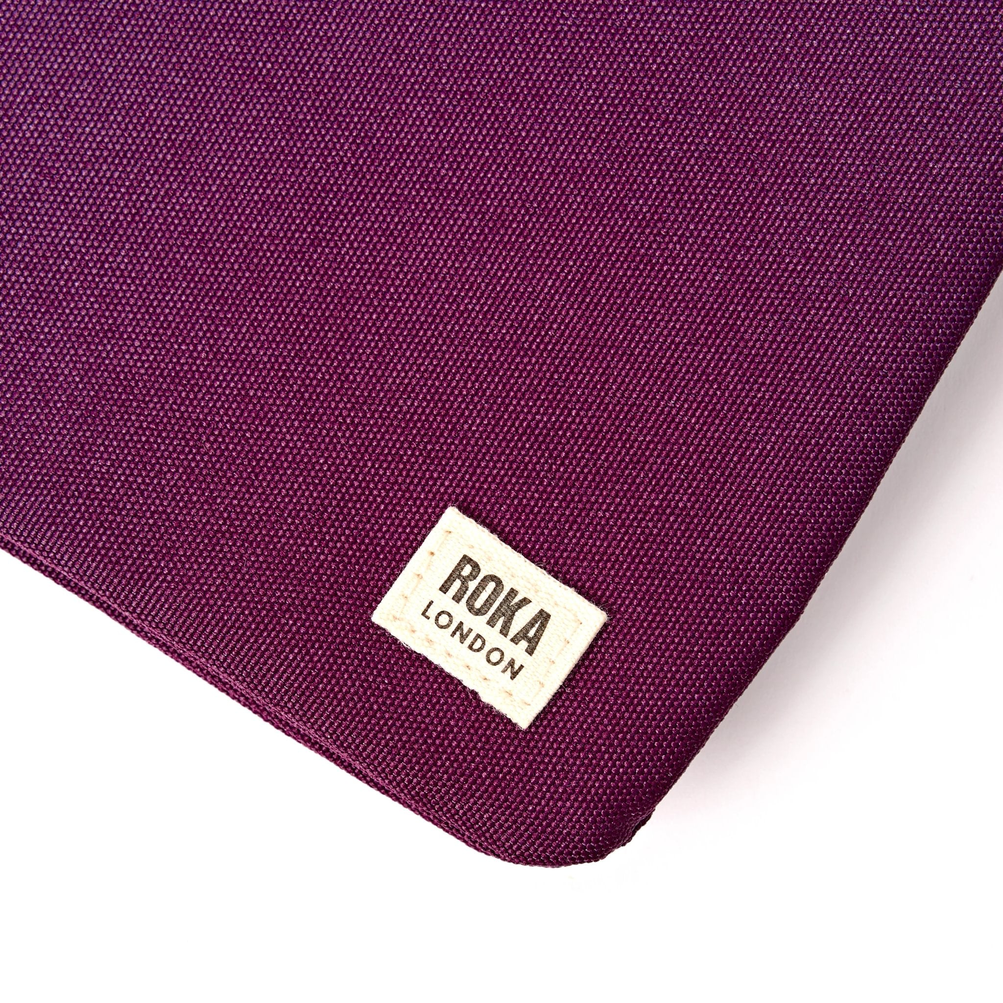 Roka Carnaby Crossbody XL Cherry Lacquer Recycled Canvas Extra Large, brand label detail.