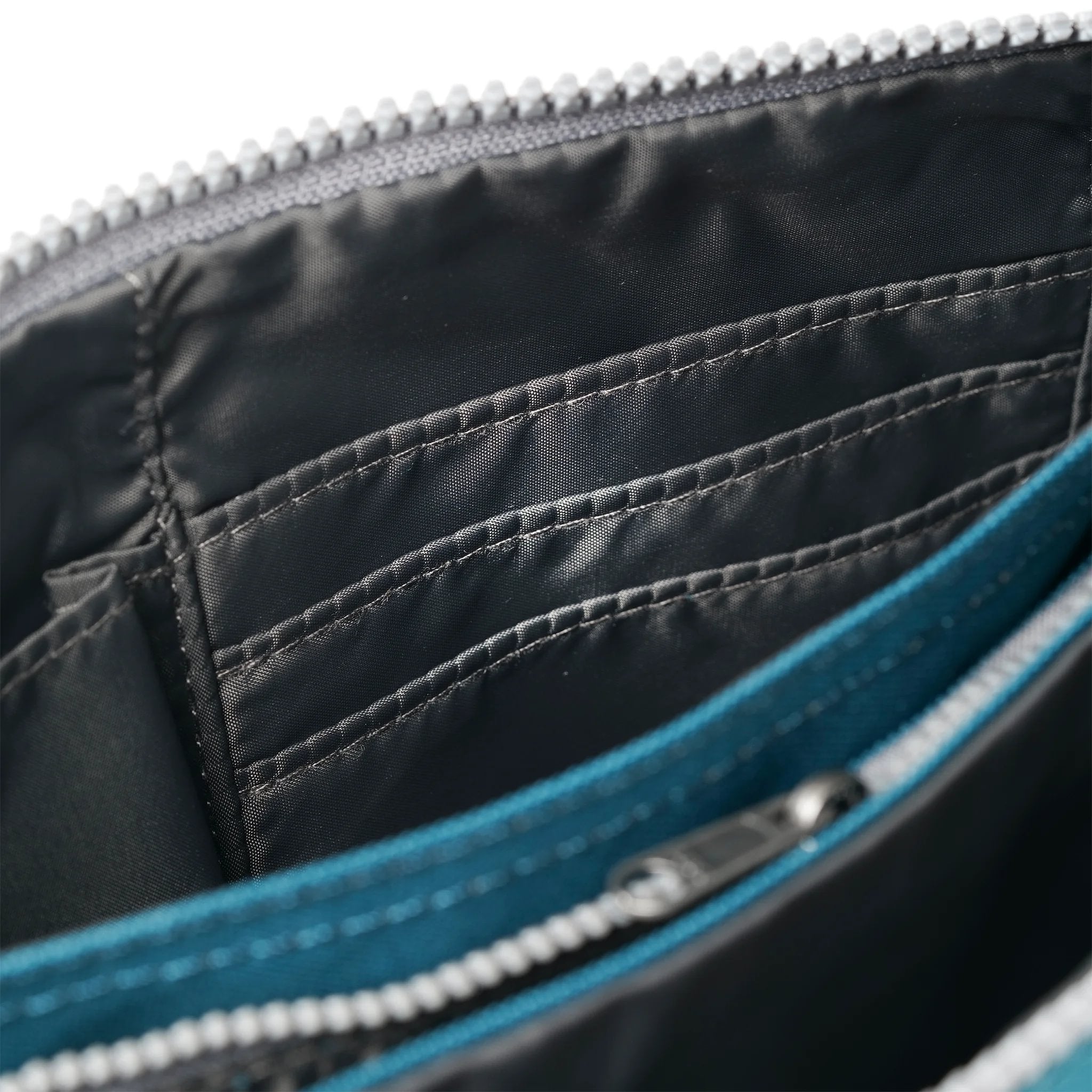 Roka Carnaby Crossbody XL Marine Recycled Canvas, side view.