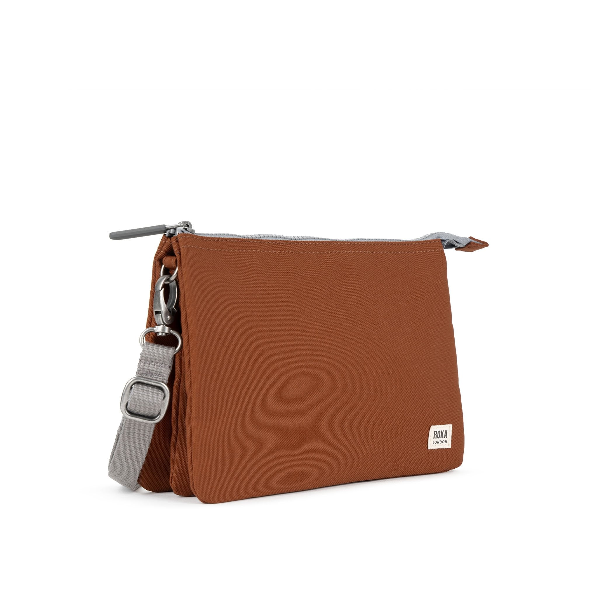 Roka Carnaby XL Bran Recycled Canvas Crossbody Bag, side view.