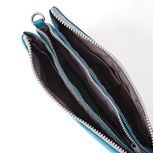 Roka Carnaby XL Deep Teal Recycled Canvas Crossbody Bag, side view.