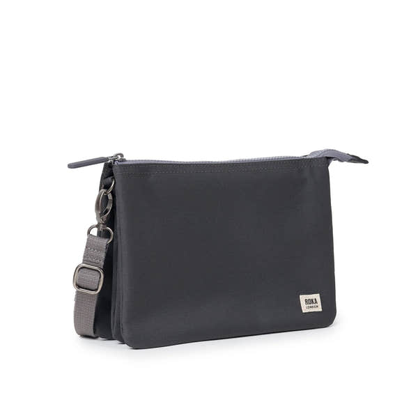Roka Carnaby XL Faded Black Recycled Canvas Crossbody Bag, side view.