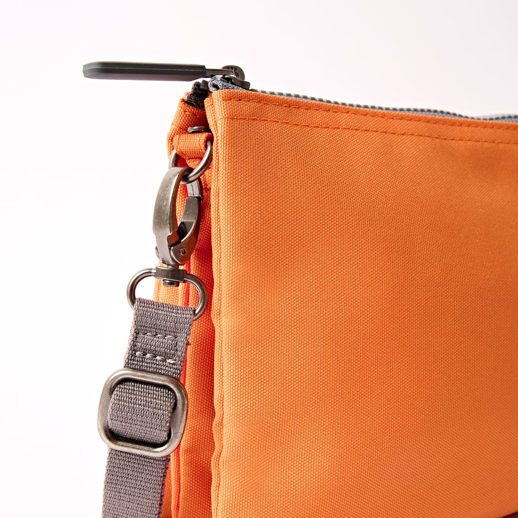 Roka Carnaby XL Jaffa Orange Recycled Canvas Crossbody Bag, hardware detail.