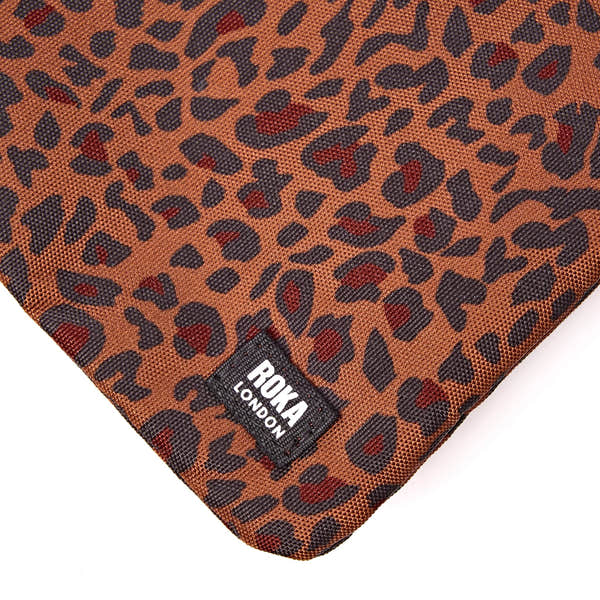 Roka Carnaby XL Mini Leopard Recycled Canvas Crossbody Bag, brand label detail.