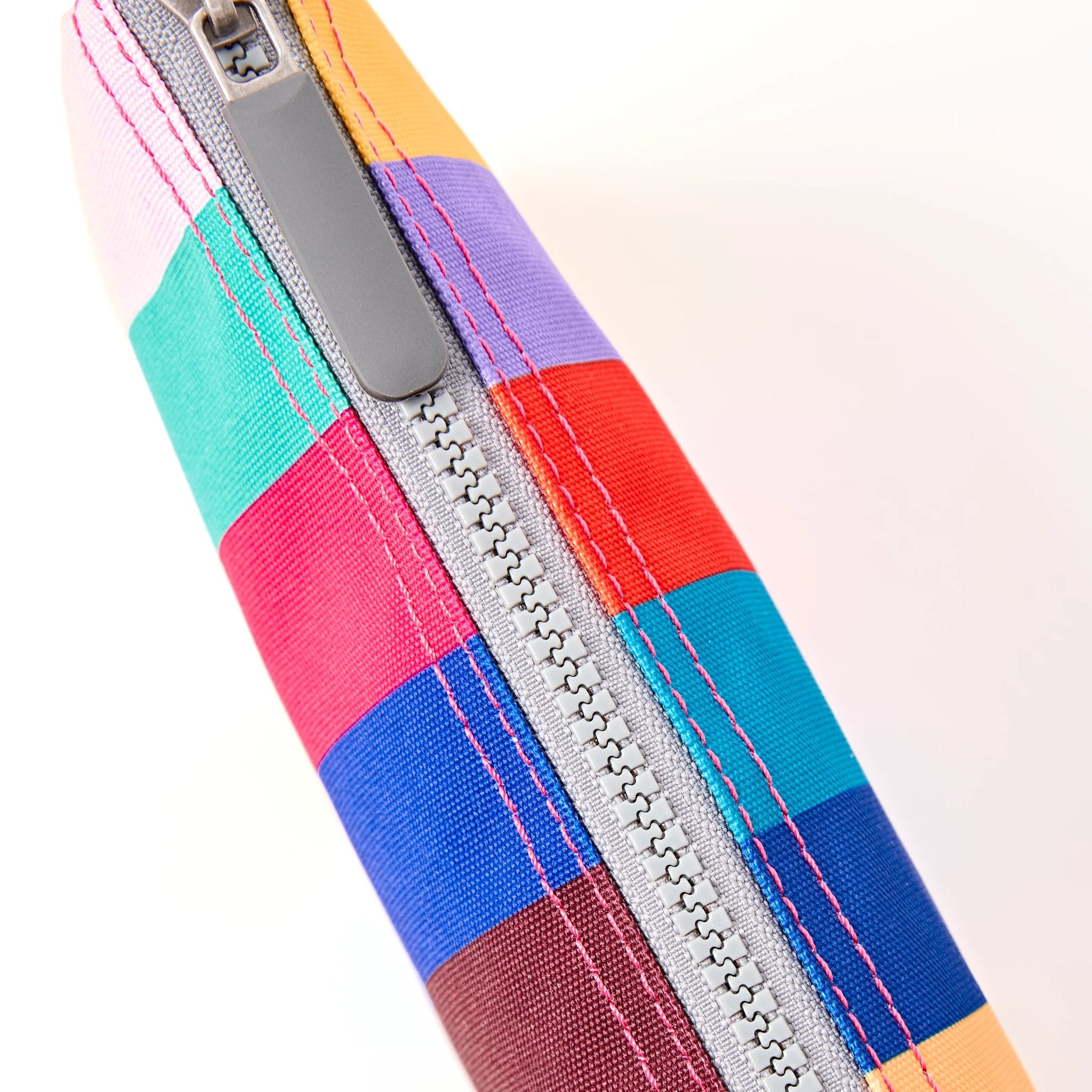 Roka Carnaby XL Wide Multi Stripe Recycled Canvas Crossbody Bag, zip detail.