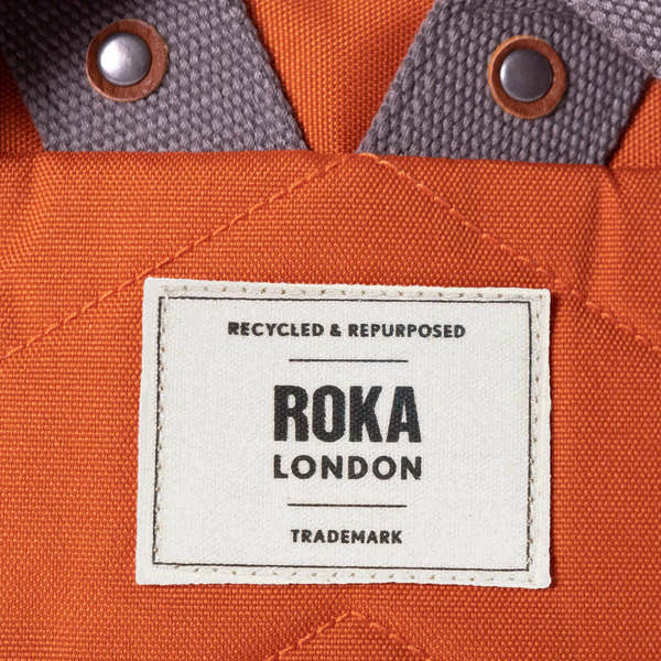 Roka Finchley A Atomic Orange Recycled Canvas, brand label detail.