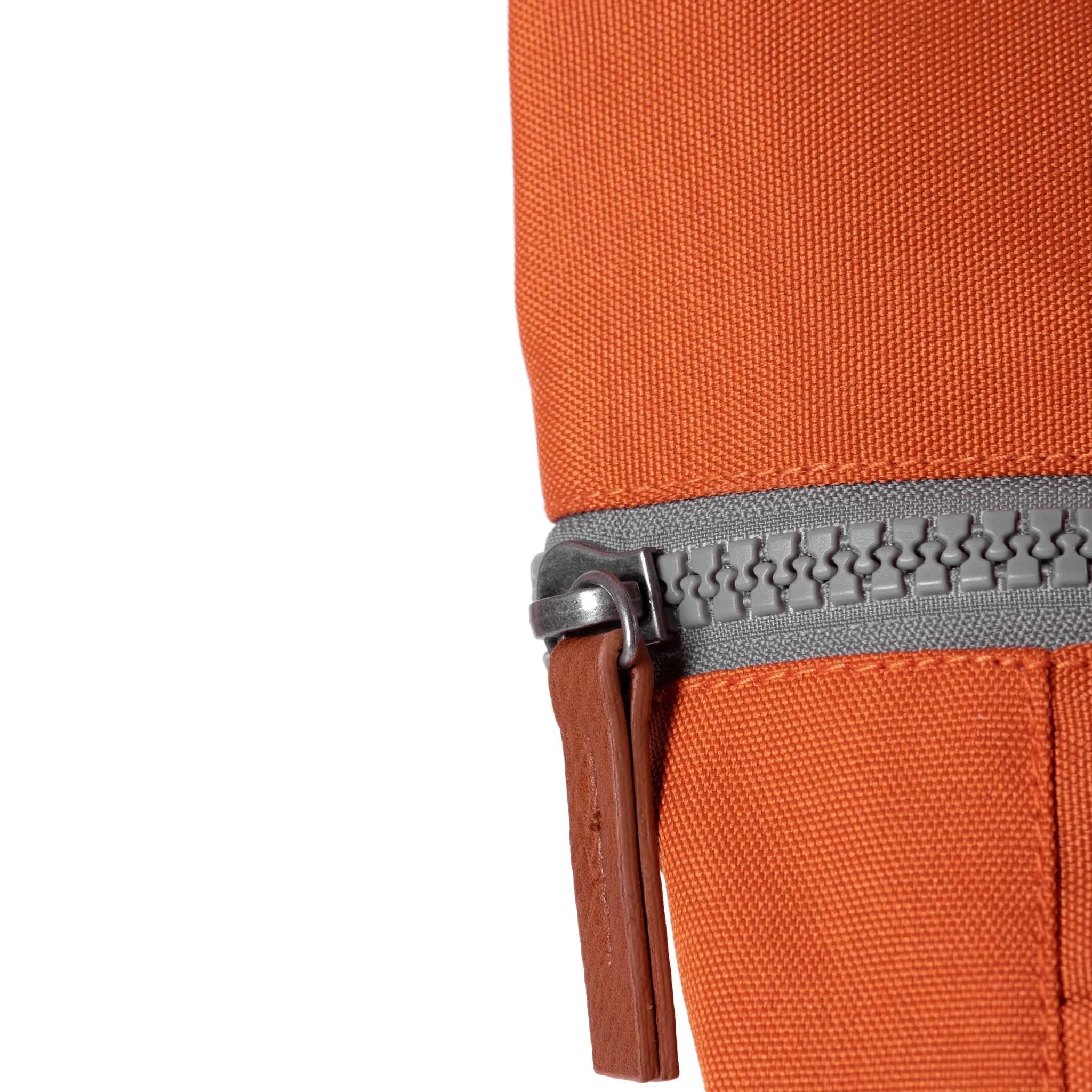 Roka Finchley A Atomic Orange Recycled Canvas, zip detail.