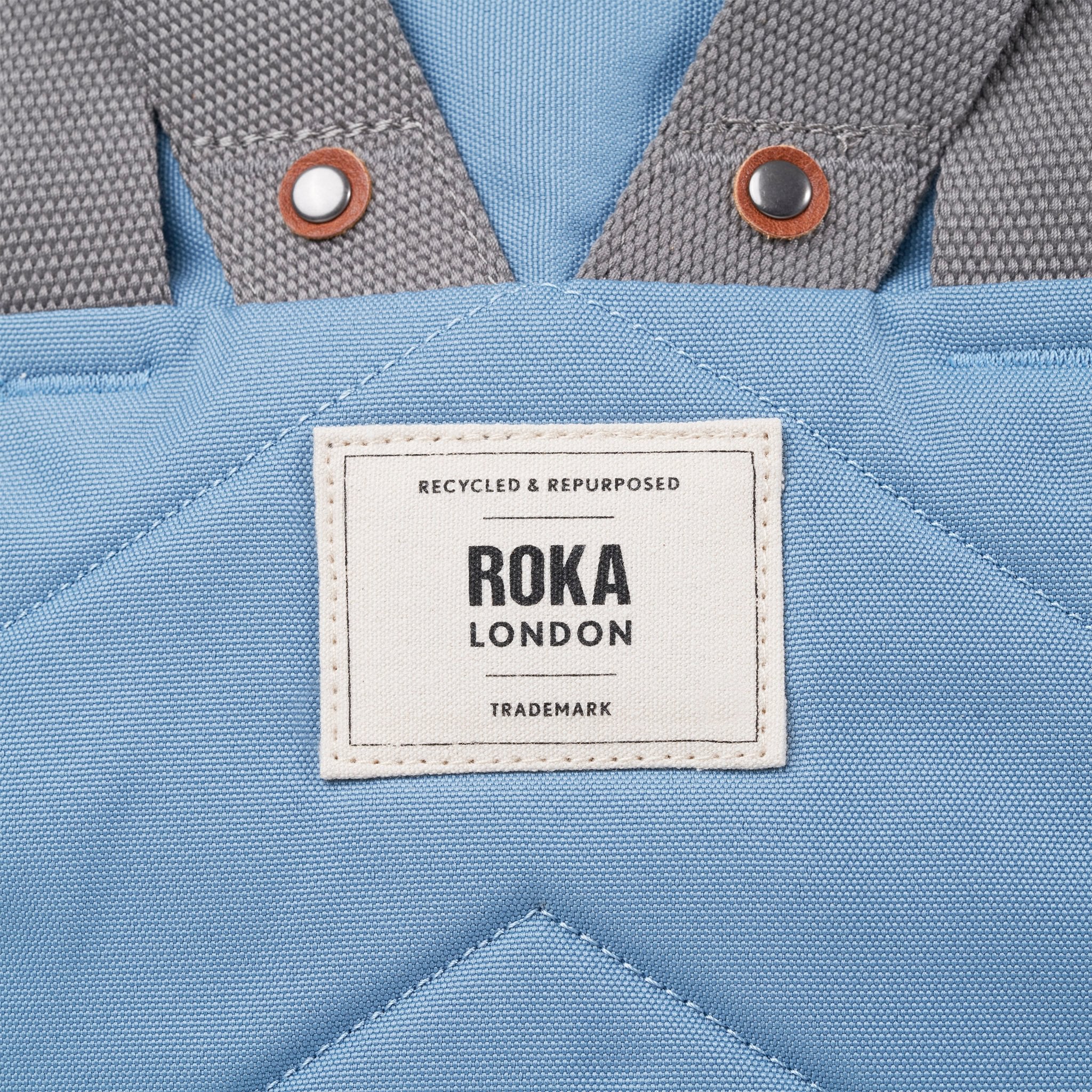 Roka Finchley A Retro Blue Recycled Canvas, brand label detail.