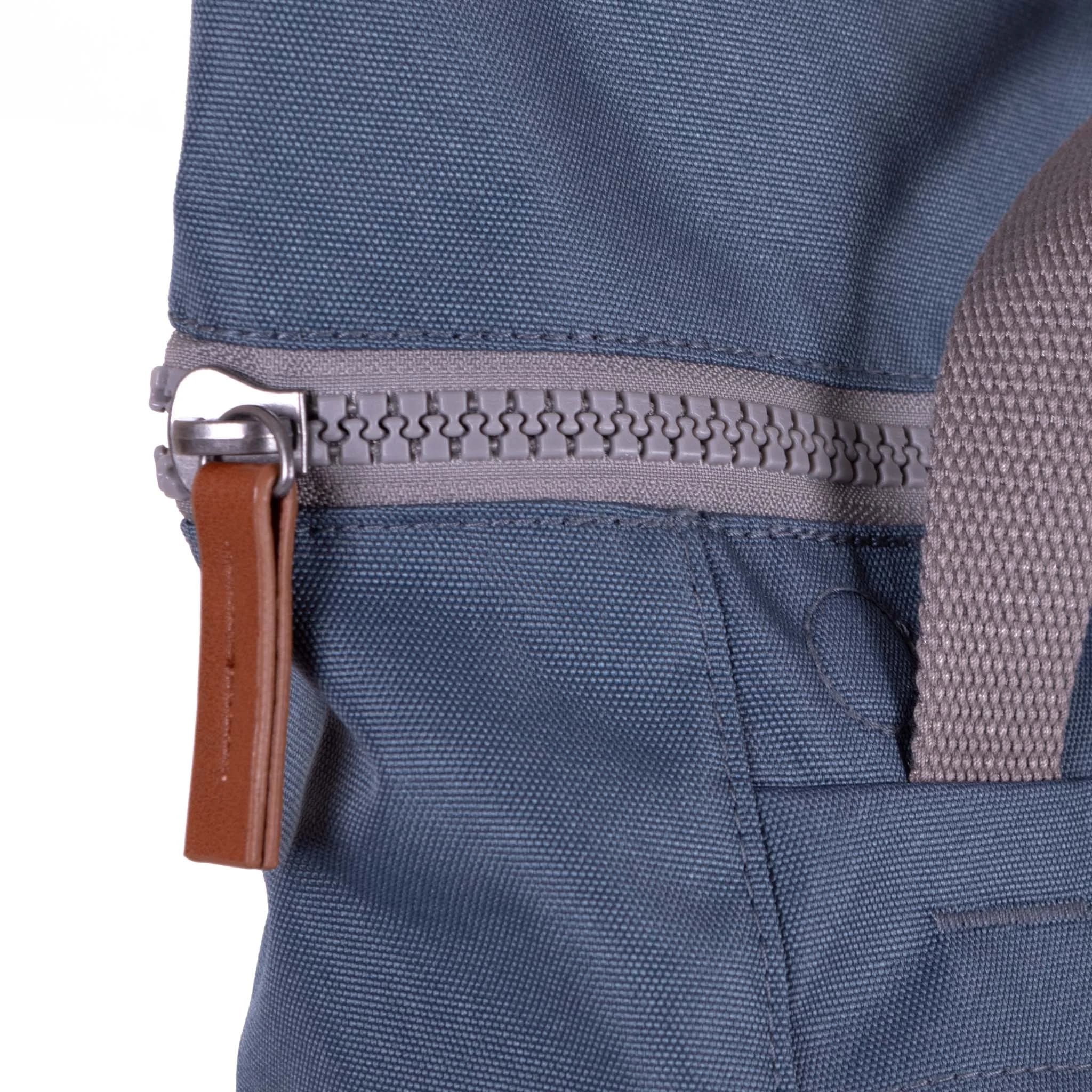 Roka Finchley Medium Airforce Recycled Canvas Backpack, zip detail.