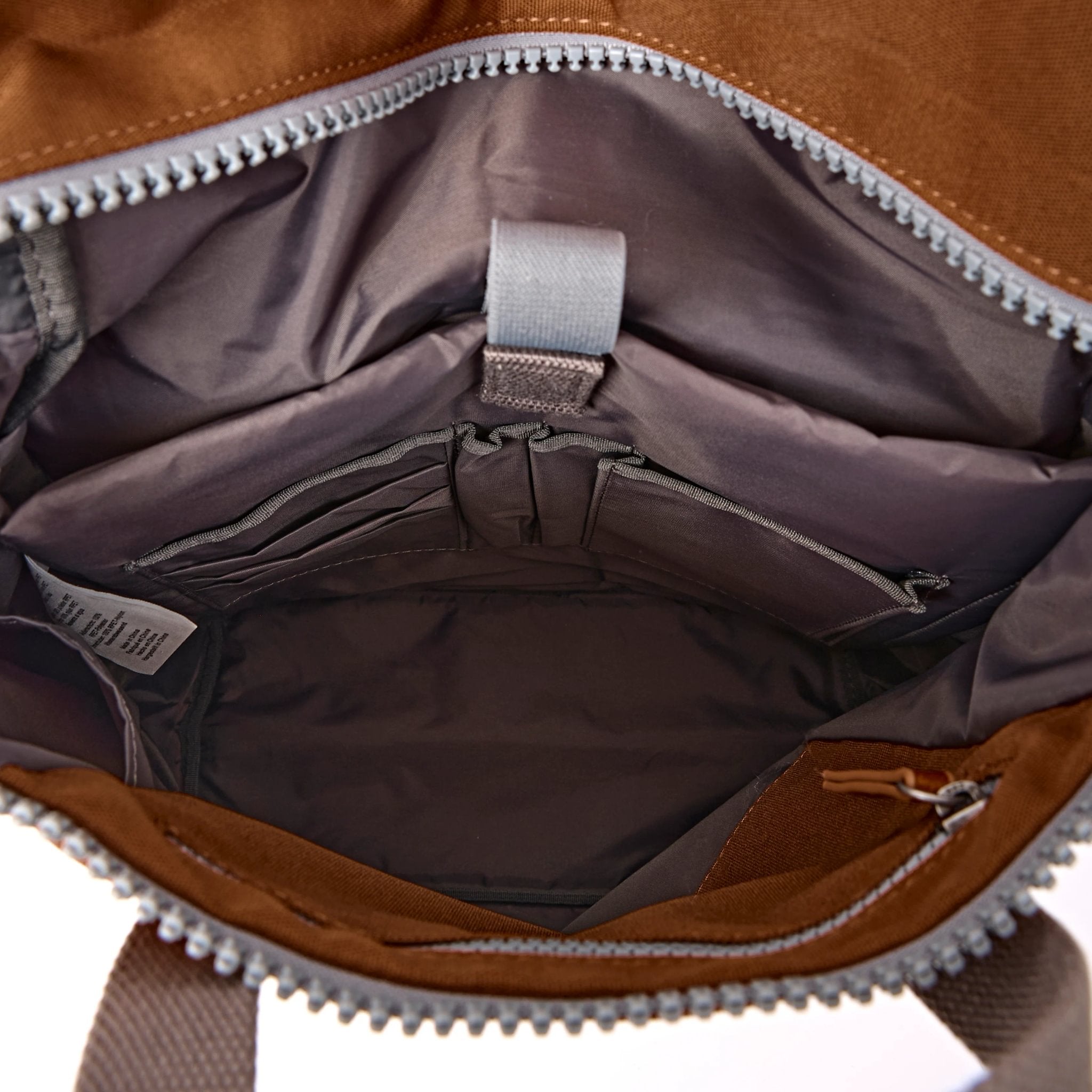 Roka Finchley Medium Cinnamon Recycled Canvas Backpack, side view.