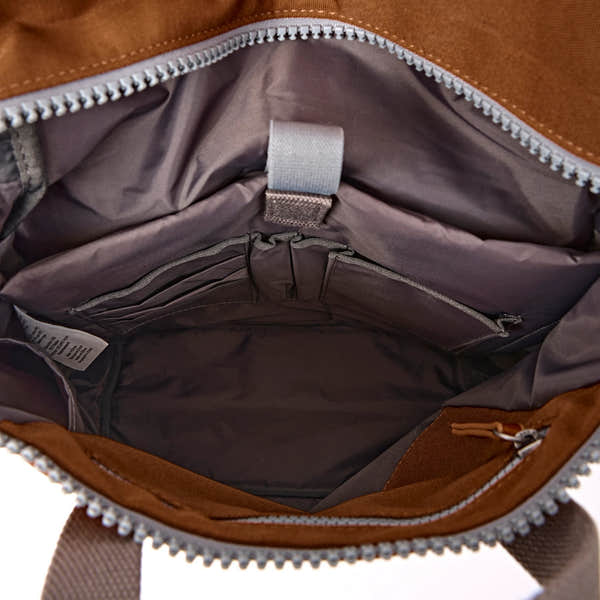 Roka Finchley Medium Cinnamon Recycled Canvas Backpack, side view.