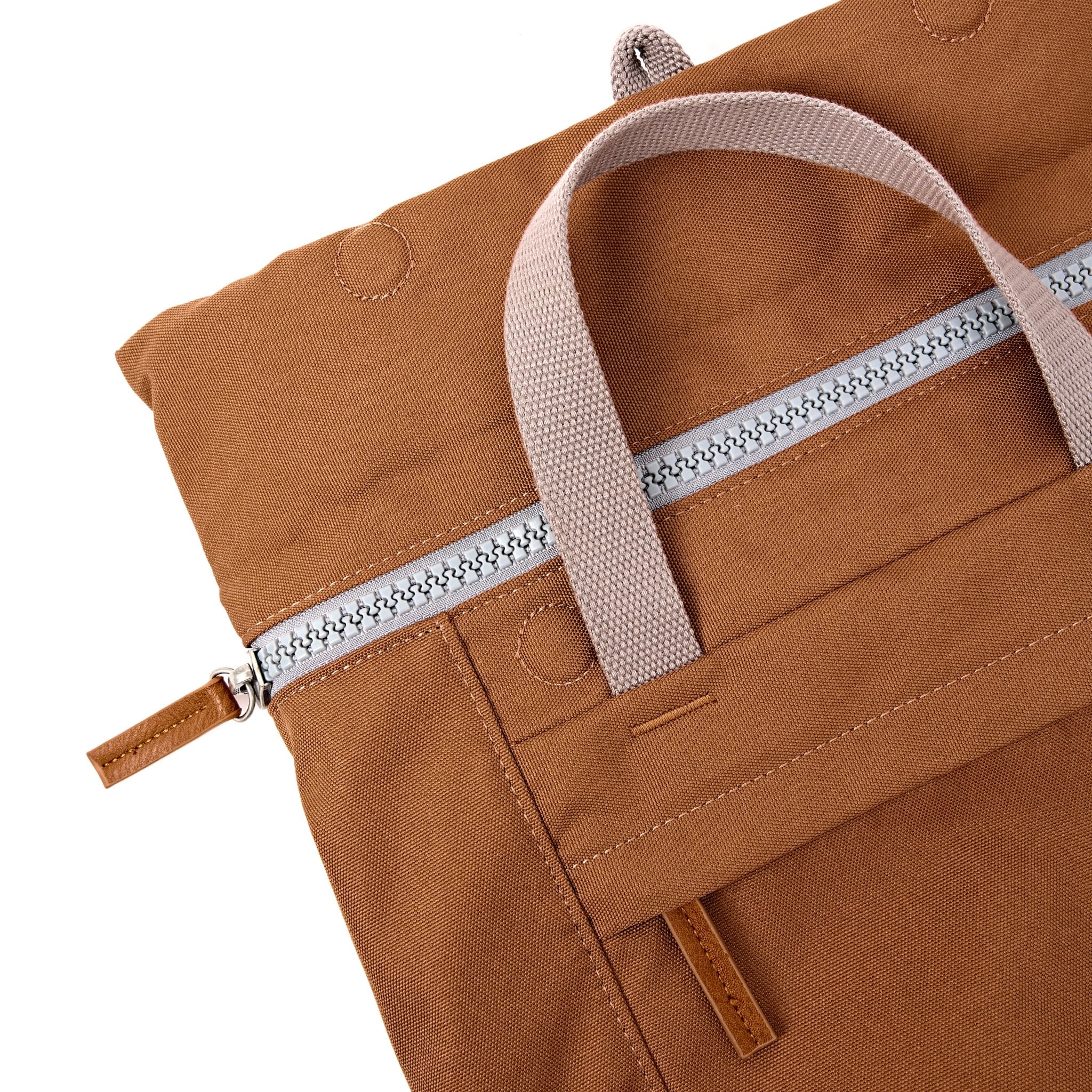 Roka Finchley Medium Cinnamon Recycled Canvas Backpack, zip detail.