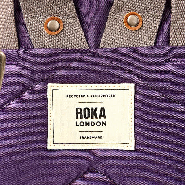Roka Finchley Medium Deep Grape Recycled Canvas Backpack, brand label detail.