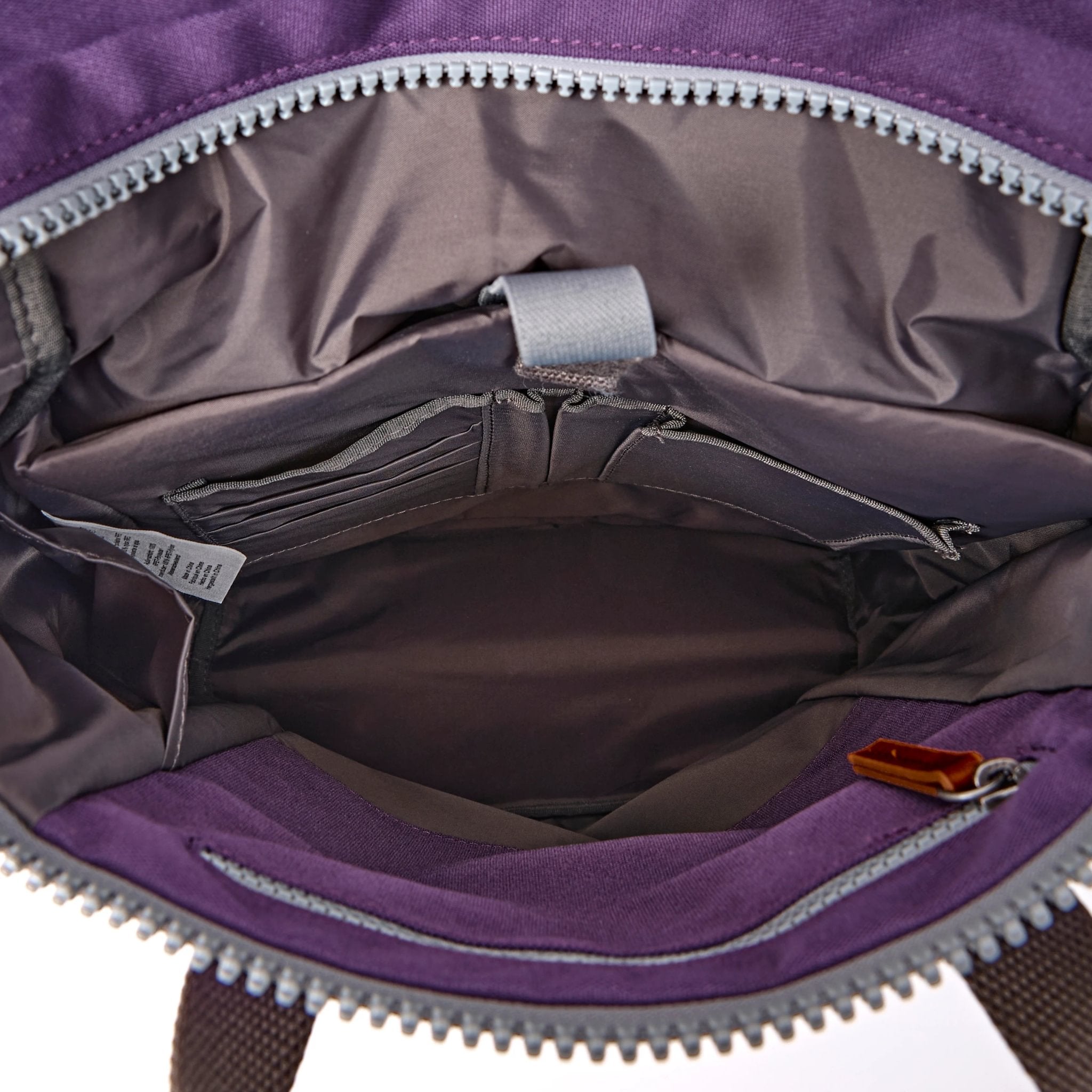 Roka Finchley Medium Deep Grape Recycled Canvas Backpack, side view.