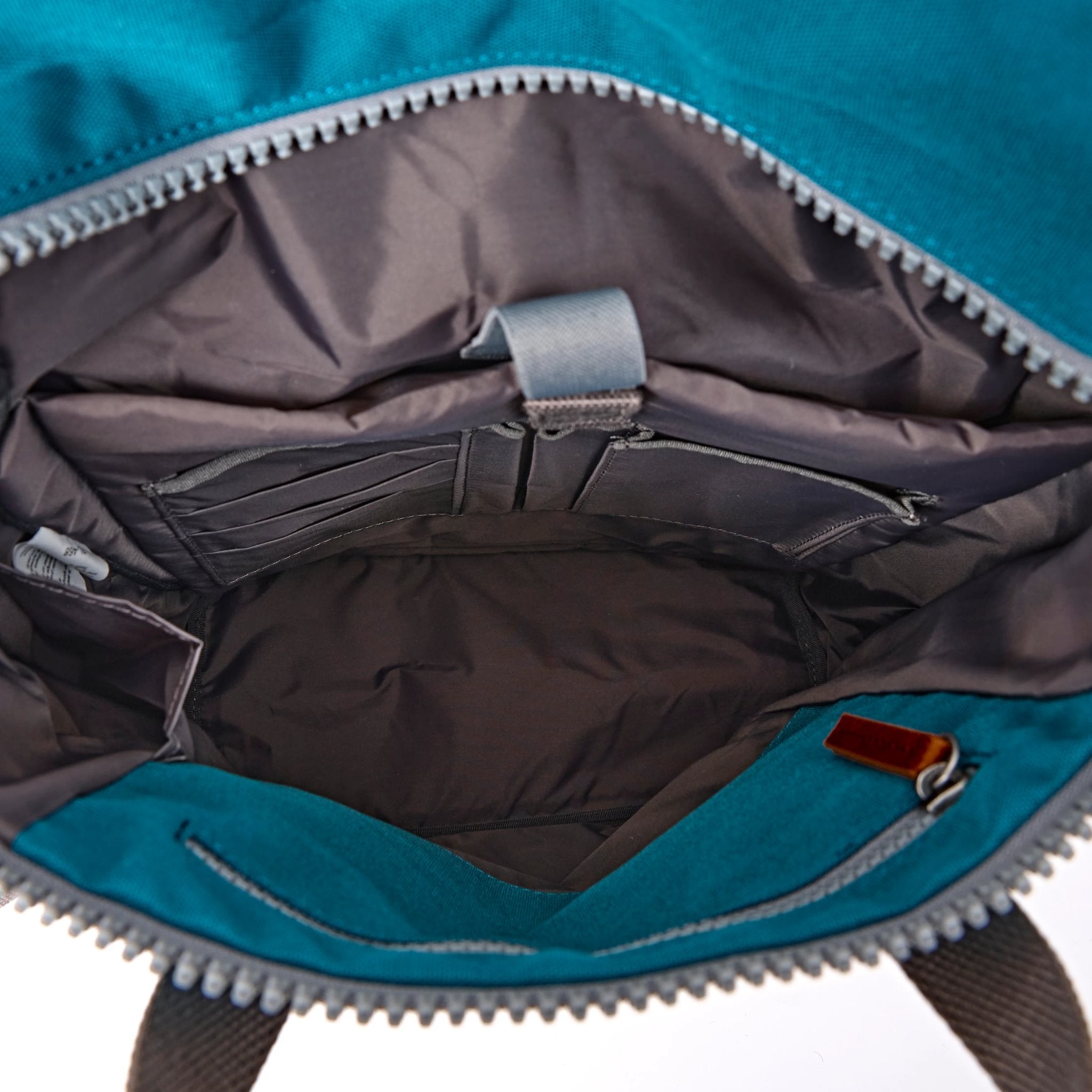 Roka Finchley Medium Deep Teal Recycled Canvas Backpack, side view.