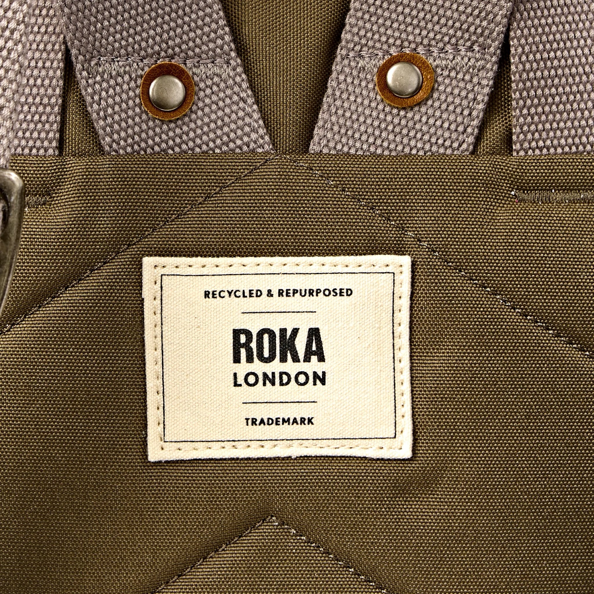 Roka Finchley Medium Sea Spray Recycled Canvas Backpack, brand label detail.