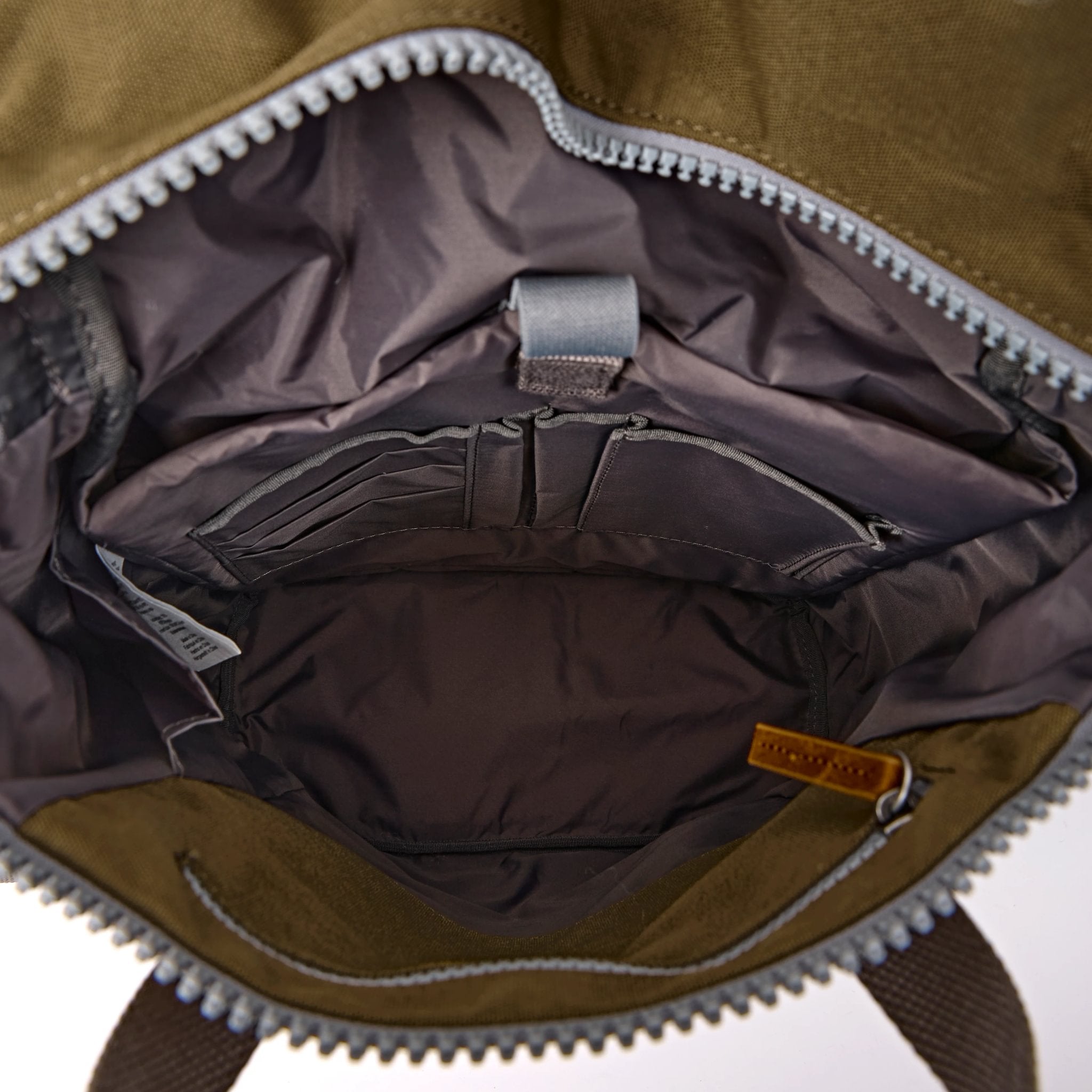 Roka Finchley Medium Sea Spray Recycled Canvas Backpack, side view.