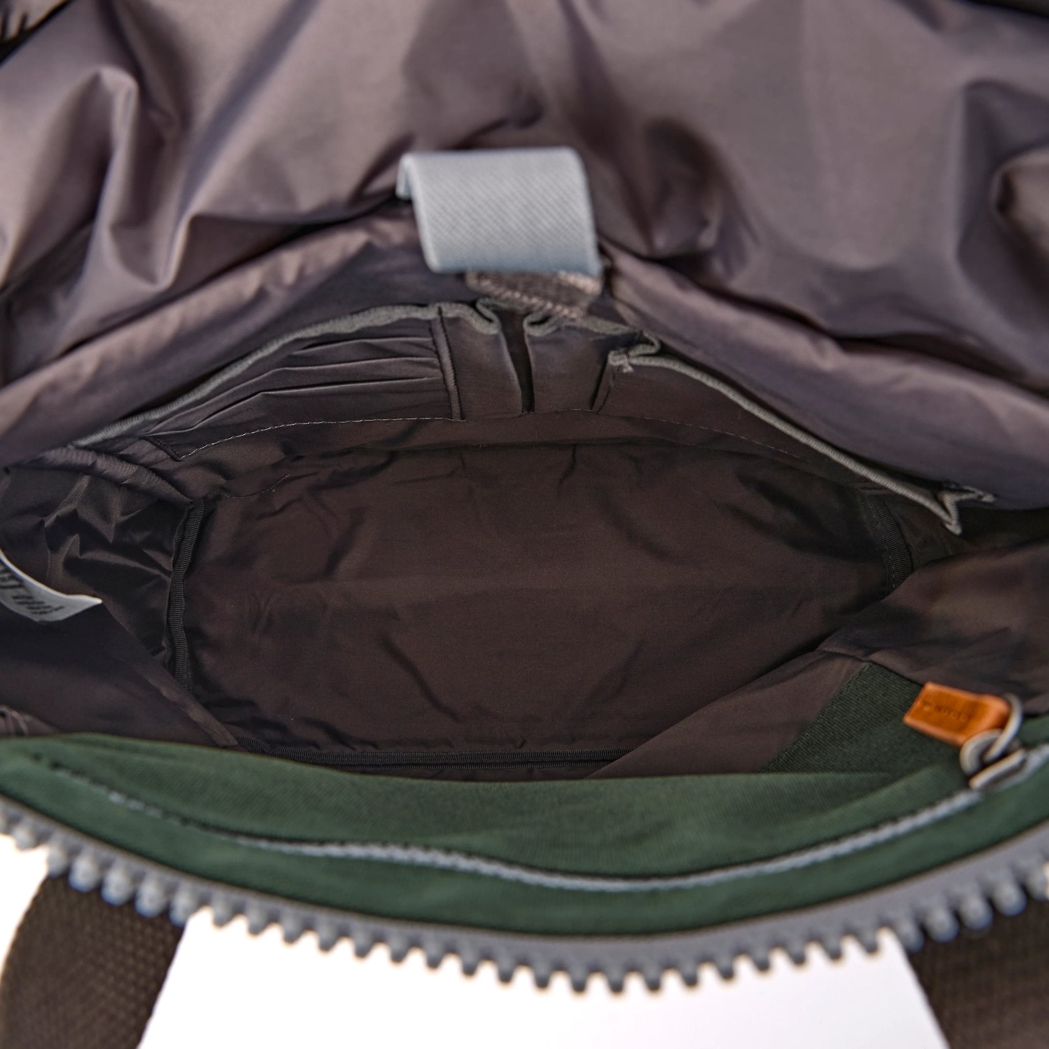 Roka Finchley Medium Thunderstorm Recycled Canvas Backpack, side view.