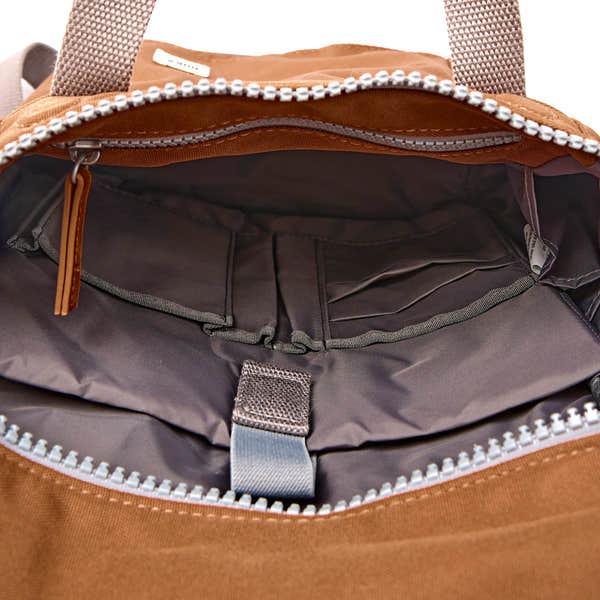 Roka Finchley Small Cinnamon Recycled Canvas Backpack, side view.