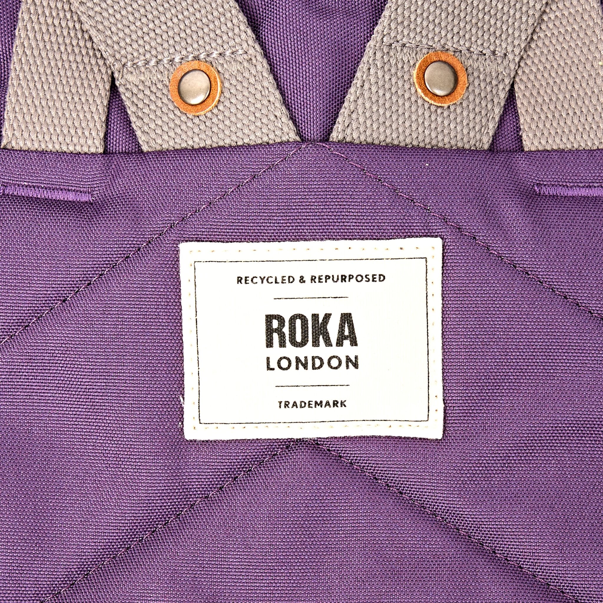 Roka Finchley Small Deep Grape Recycled Canvas Backpack, brand label detail.