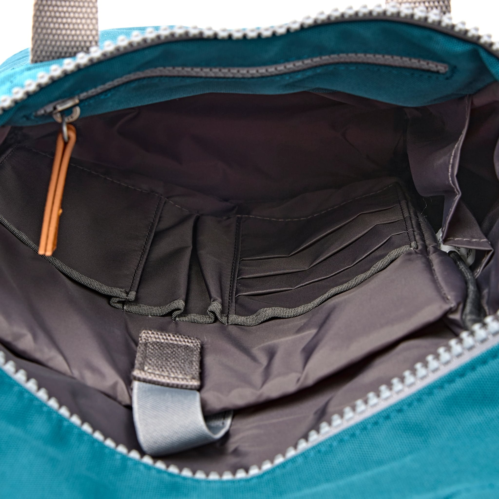 Roka Finchley Small Deep Teal Recycled Canvas Backpack, side view.