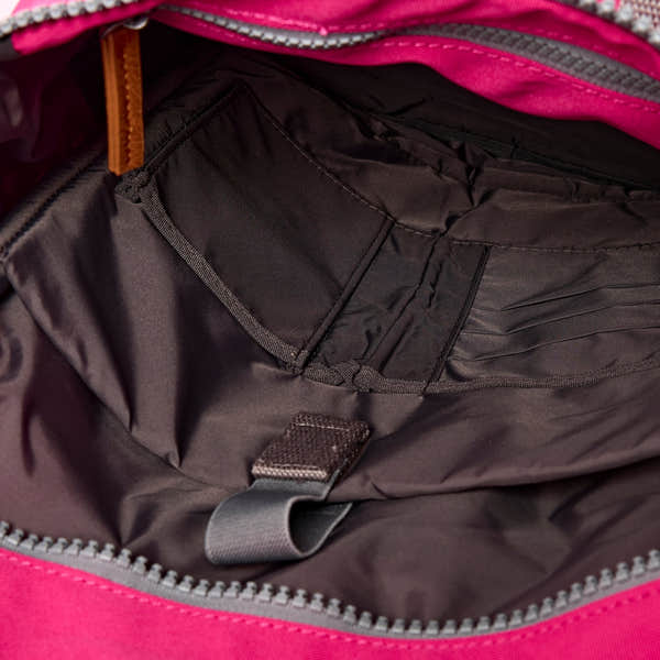 Roka Finchley Small Granita Red Recycled Canvas Backpack, side view.