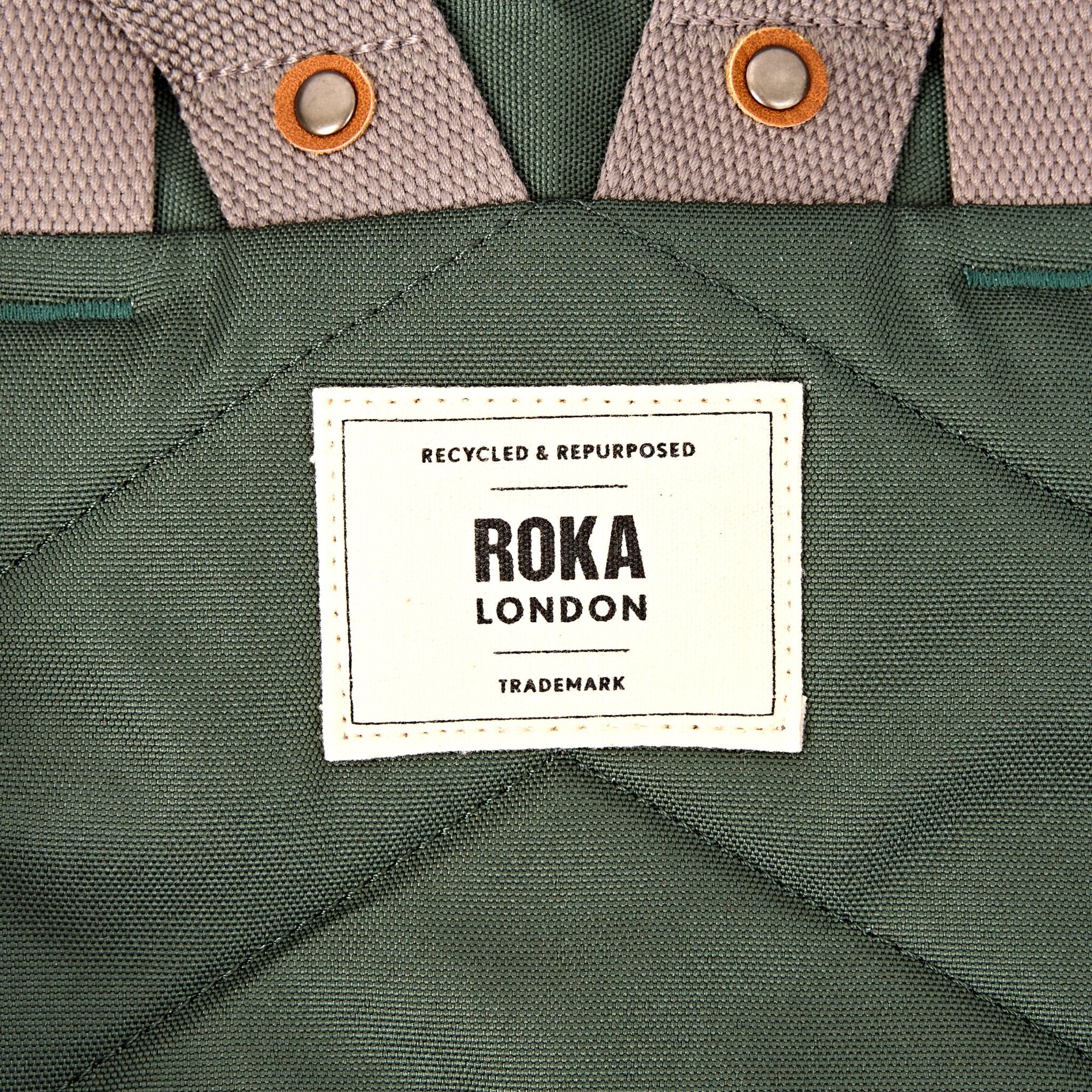 Roka Finchley Small Thunderstorm Recycled Canvas Backpack, brand label detail.