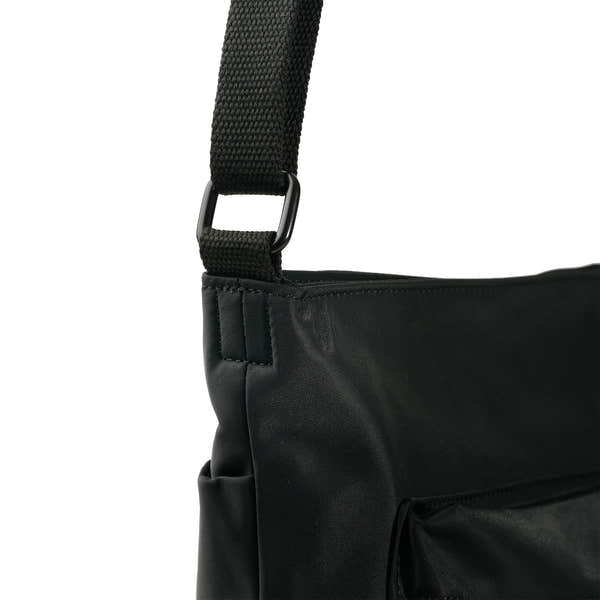 Roka Kennington B Crossbody Recycled Nylon Airforce, strap detail.